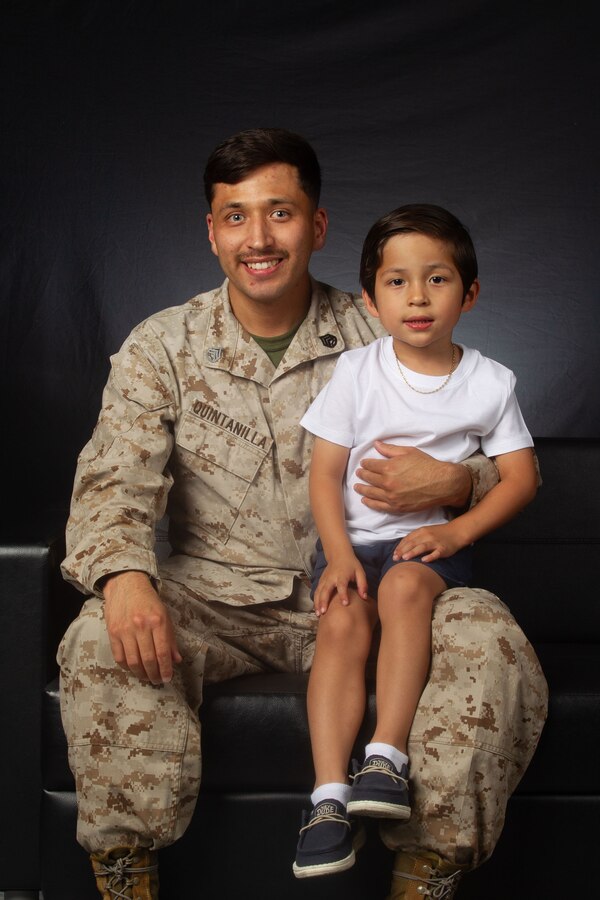 U.S. Marine Corps Staff Sgt. Jesus Quintanilla, a Greenville, South Carolina native, ground electronics system maintenance technician with Marine Corps Communication-Electronics School, Training Command, Training and Education Command, poses with his child during a Father’s Day photoshoot at Marine Corps Air-Ground Combat Center, Twentynine Palms, California, June 12, 2024. The Combat Center is dedicated to honoring and showing appreciation to active-duty fathers and father figures who not only are committed to serving their country but also their families. (U.S. Marine Corps photo by Lance Cpl. Anna Higman)