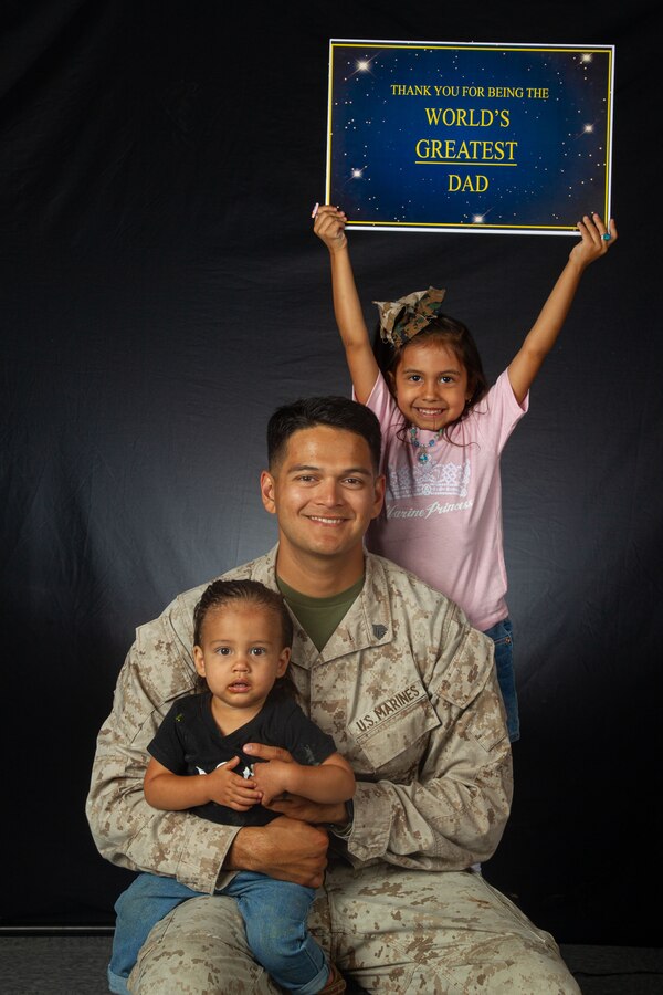 U.S. Marine Corps Sgt. Eduardxavi Napoliello, a Laporte, Texas native, transmission system operator instructor with Marine Corps Communication-Electronics School, Training Command, Training and Education Command, poses with his children during a Father’s Day photoshoot at Marine Corps Air-Ground Combat Center, Twentynine Palms, California, June 12, 2024. The Combat Center is dedicated to honoring and showing appreciation to active-duty fathers and father figures who not only are committed to serving their country but also their families. (U.S. Marine Corps photo by Lance Cpl. Anna Higman)