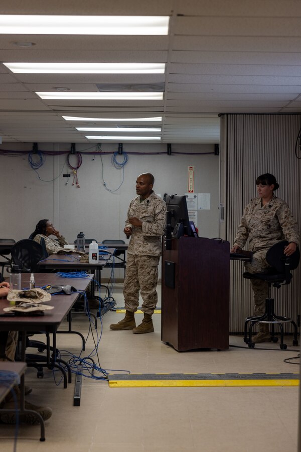 U.S. Navy corpsmen with Tactical Training and Exercise Control Group, Marine Air-Ground Task Force Training Command, Marine Corps Air-Ground Combat Center, give a tactical combat casualty care brief, at MCAGCC, Twentynine Palms, California, June 13, 2024. TCCC ensures Marines are trained to properly preform medical procedures to prevent loss of life and ensure force preservation. ITX enables Marine Forces Reserve to mobilize geographically dispersed forces for potential future deployments, increase combat readiness and lethality, and exercise Marine Air-Ground Task Force command and control of battalions and squadrons across the full spectrum of warfare. (U.S. Marine Corps photo by Lance Cpl. Anna Higman)