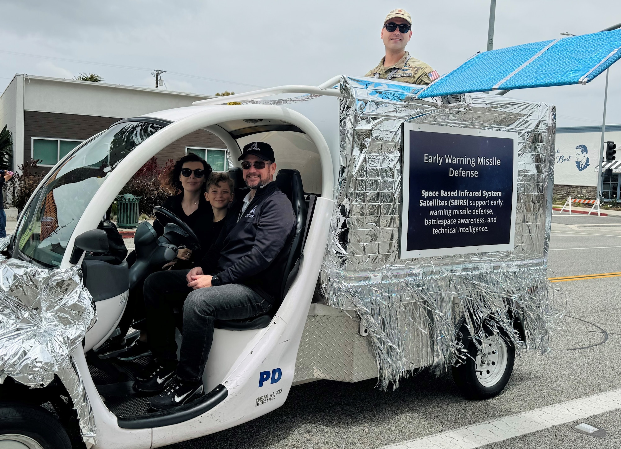 Mr. Mike Dolan, deputy program executive officer for Space Sensing at Space Systems Command, accompanied by his family, drives the USSF Space Based Infrared System (SBIRS) satellite-inspired float as Space Force’s Polaris Award Winner, Maj. Anthony Gentry rides atop, at the 62nd annual Torrance Armed Forces Day Parade and Celebration. The U.S. Space Force was the Parade’s honored military branch and Lt. Gen. Philip Garrant, commander of Space Systems Command, served as the Grand Marshal of the parade and festivities. (U.S. Space Force courtesy photo)