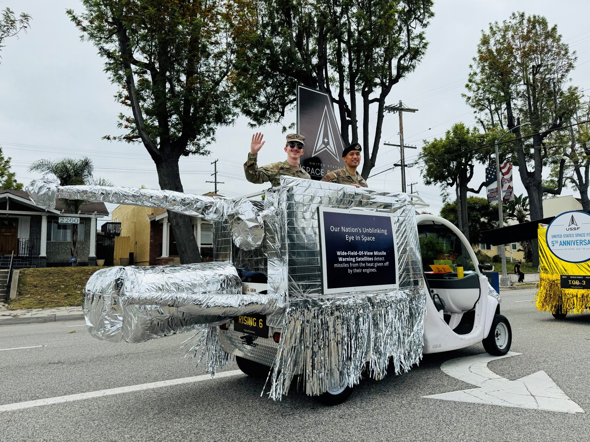 The second of three USSF satellite-inspired floats at the 62nd annual Torrance Armed Forces Day Parade and Celebration represents a Wide-Field-of-View (WFOV) Missile Warning satellite. The WFOV float is driven by Torrance Military Affairs Council Hidden Hero Winner, Sgt. Melvin Smith, and accompanied by fellow award winners, Capt. Wesley Jackson and Tech. Sgt. Alex Inn. (U.S. Space Force courtesy photo)