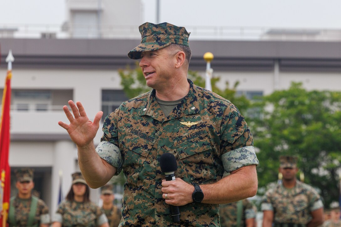 U.S. Marine Corps Lt. Col. Jacob Schwinghammer, the former commanding officer of Headquarters and Headquarters Squadron, Marine Corps Air Station Iwakuni, and a Florida native, gives a speech during a change of command ceremony at MCAS, Iwakuni, Japan, June 6, 2024. The change of command ceremony is a Marine Corps tradition which honors the outgoing commanding officer’s effort and dedication while also recognizing the oncoming commanding officer’s commitment to the unit. (U.S. Marine Corps photo by Lance Cpl. David Getz)