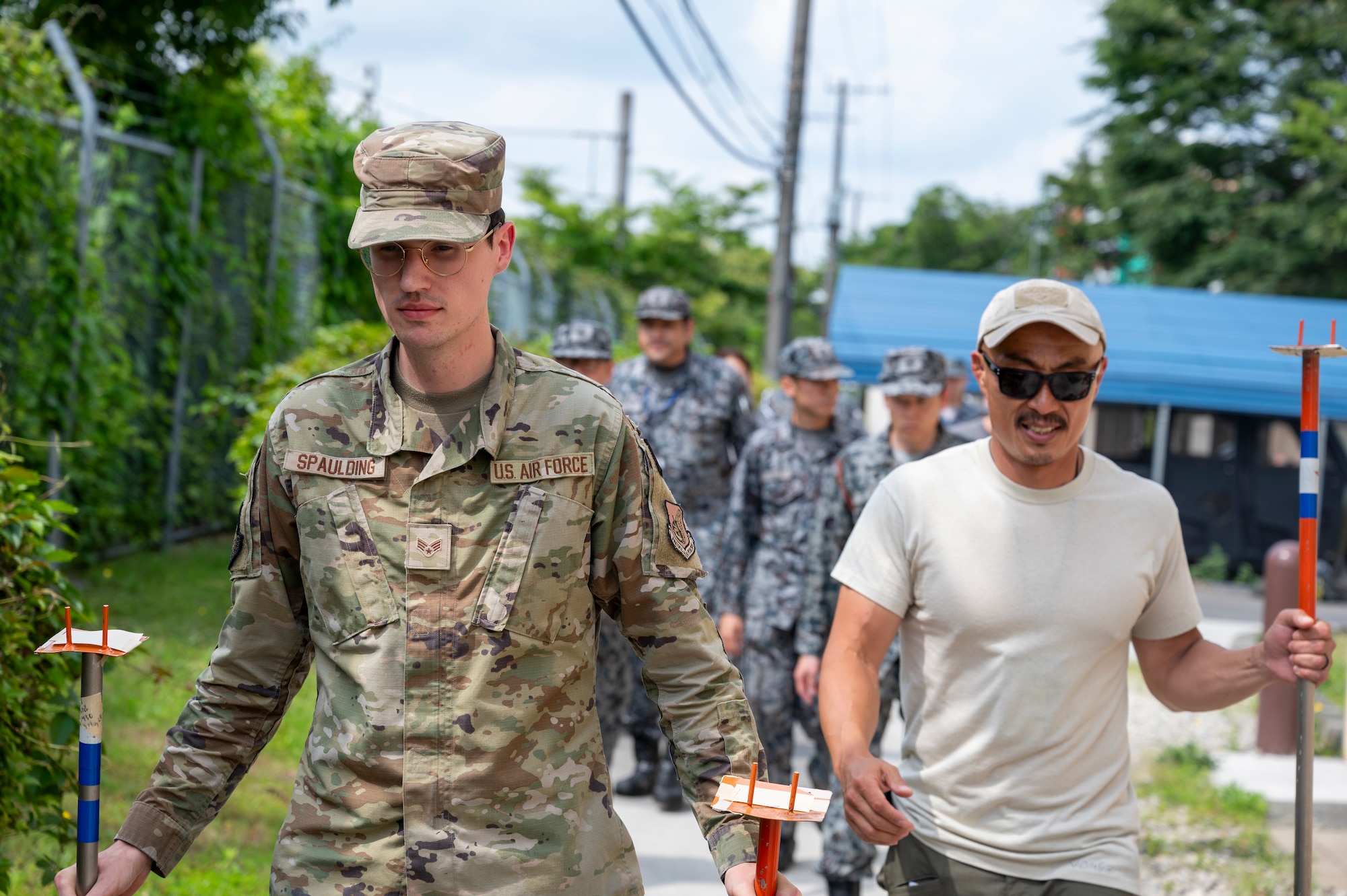 Class instructors lead members assigned to the Japan Air Self-Defense Force Operations Support Wing during a chemical, biological, radiological, and nuclear defense training class.