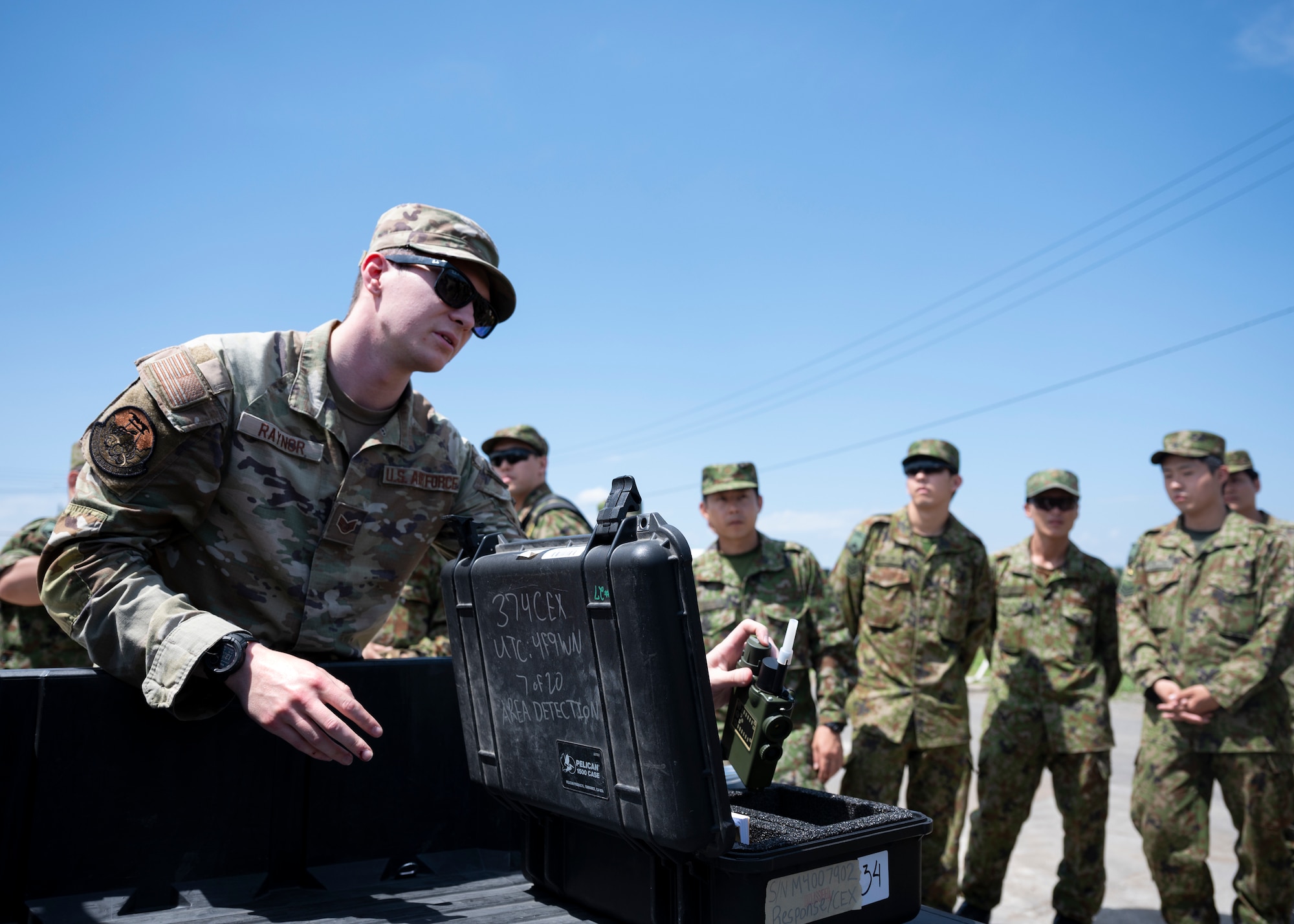 An airman grabs a Joint Chemical Agent Detector.