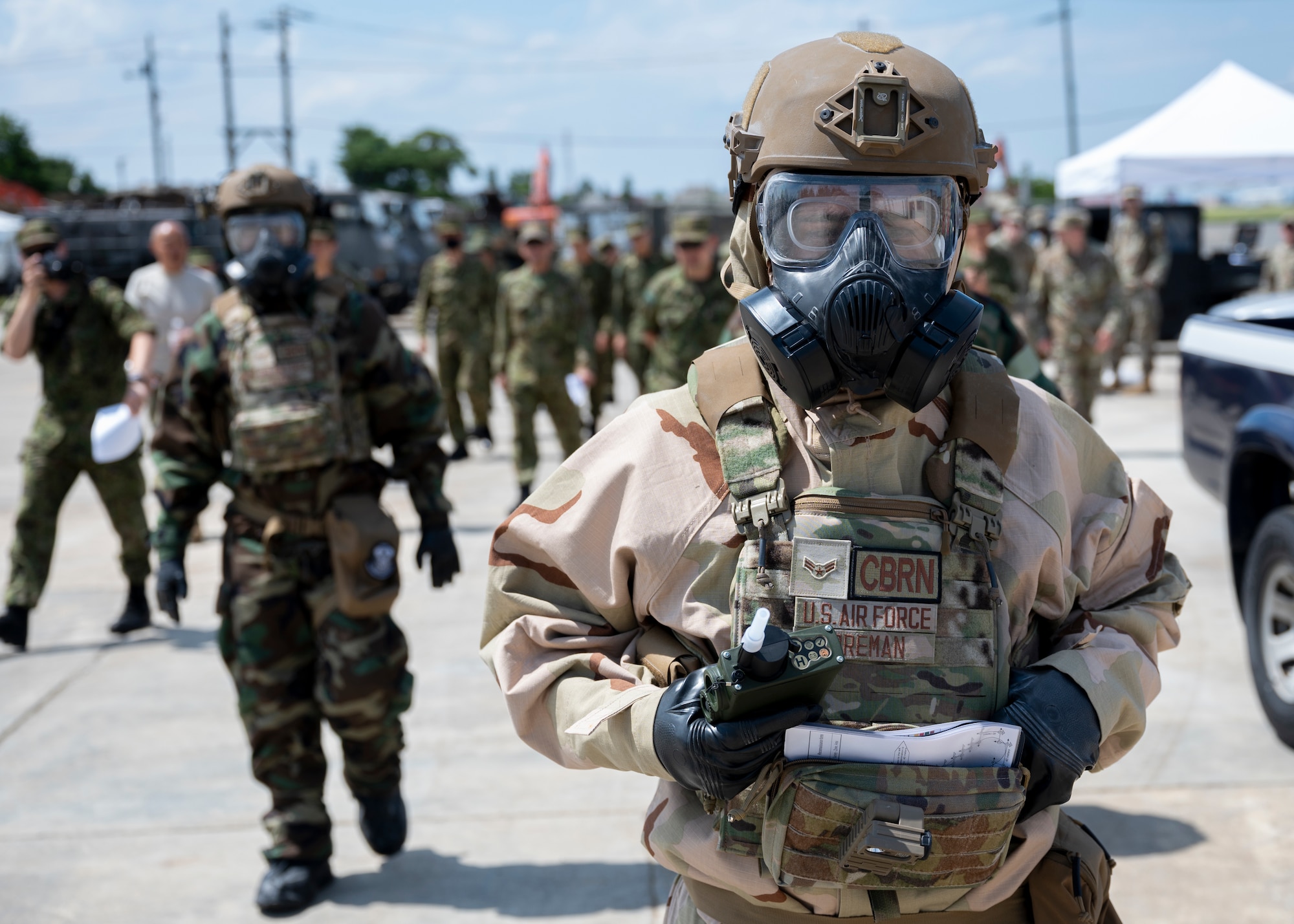 An airman prepares to demonstrate chemical detection procedures with a Joint Chemical Agent Detector.