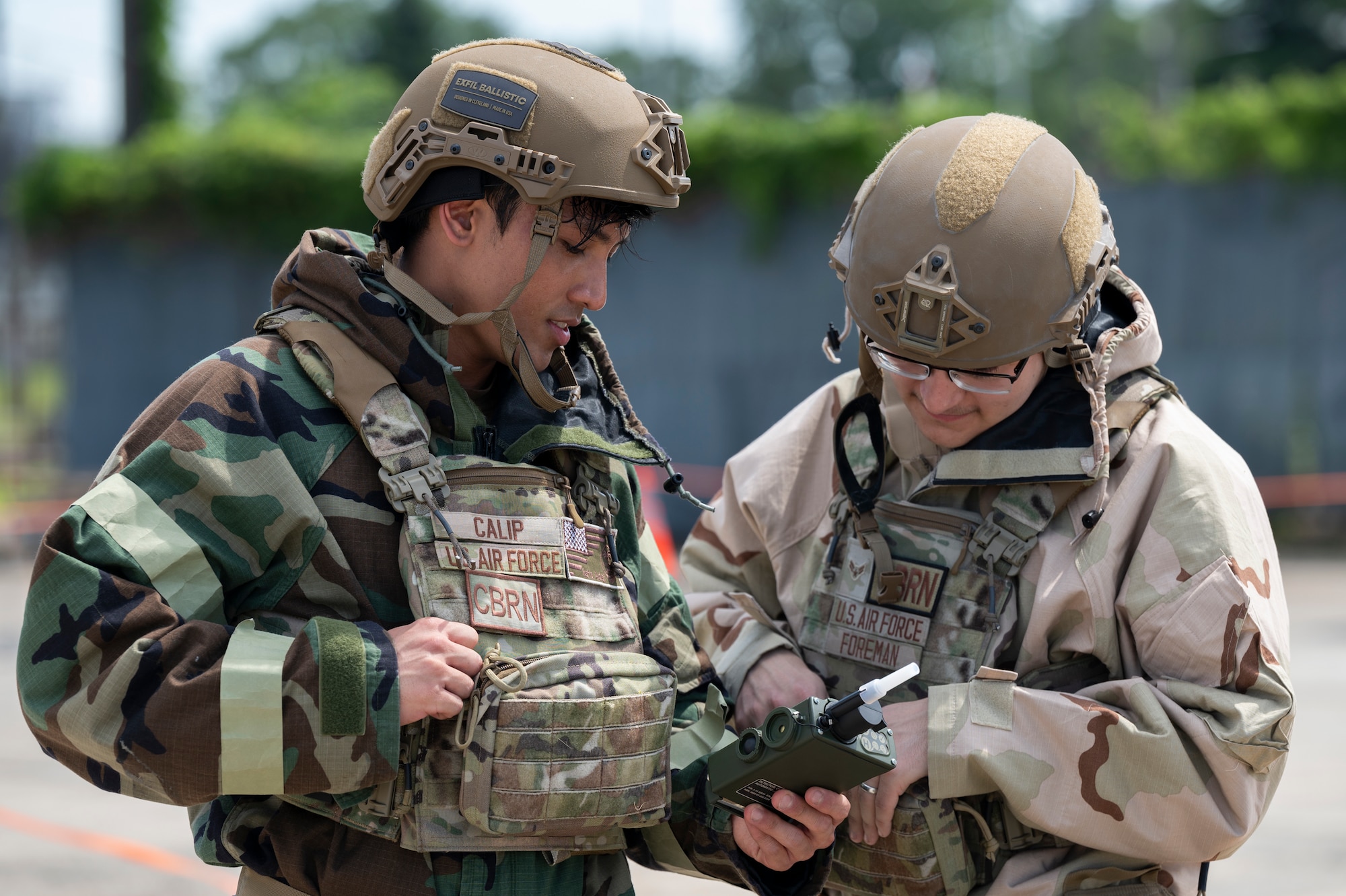 Emergency management journeymen review a joint chemical agent detector.