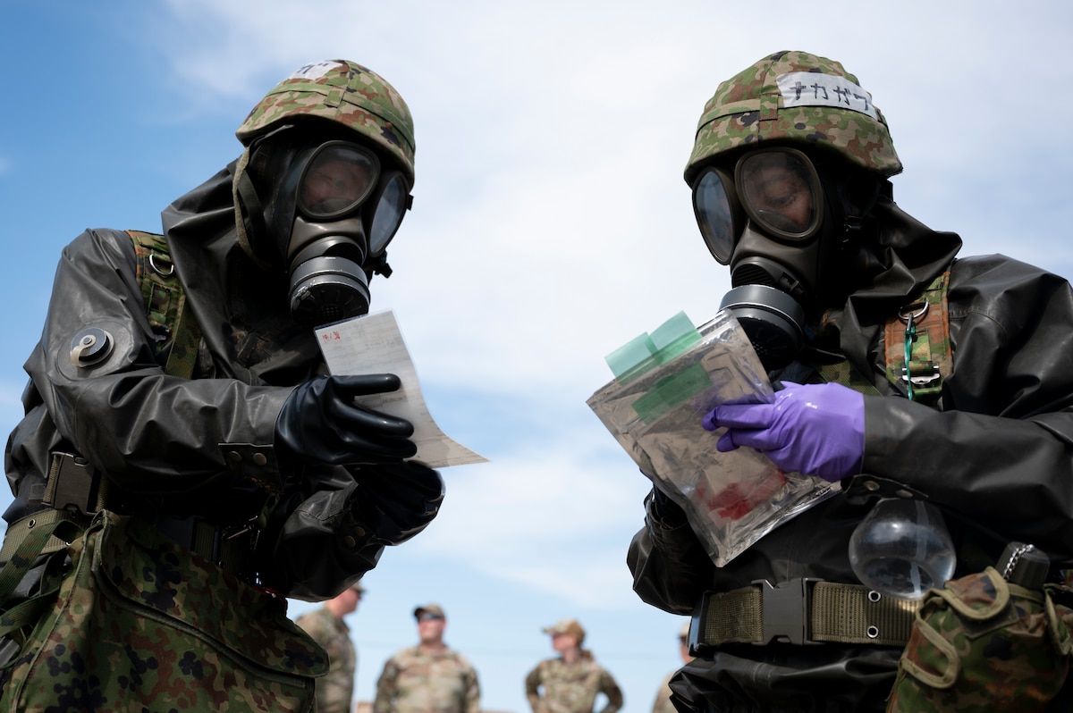 Japan Ground Self-Defense Force members review procedures.