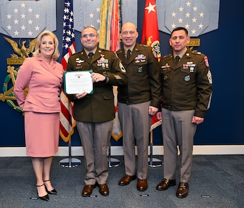 Top 13 recruiter poses with USAREC Commanding General Johnny Davis, USAREC Command Sergeant Major Shade Munday, and Secretary of the Army Christine Wormuth