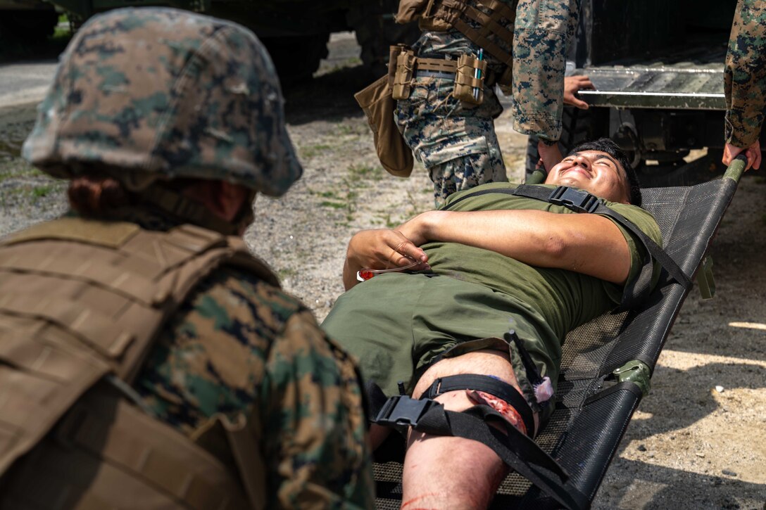 U.S. Sailors with Naval Family Branch Clinic Iwakuni transport a simulated casualty during a mass casualty exercise at Marine Corps Air Station Iwakuni, Japan, June 11, 2024. The exercise was performed to rehearse emergency response procedures and enhance both readiness and efficiency when responding to mass casualty incidents. (U.S. Marine Corps photo by Sgt. Raymond Tong)