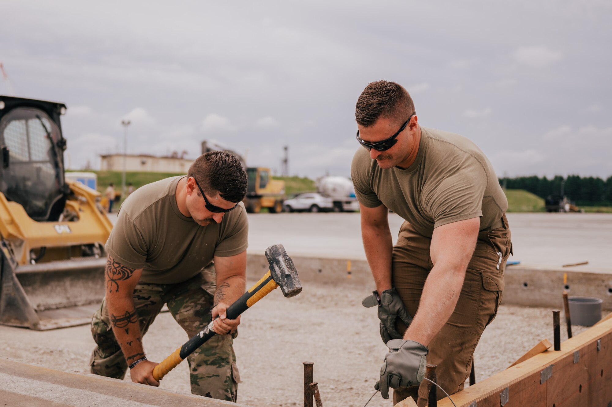 The 139th Civil Engineer Squadron, Missouri Air National Guard, lays concrete at Yokota Air Base, Japan, June 10, 2024. The Airmen work to extend the ramp to better accommodate 10 C-130J Hercules aircraft.