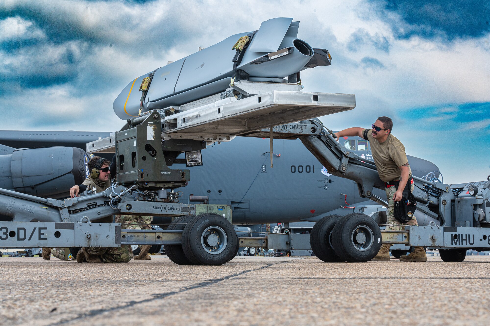Airmen from the 2nd Aircraft Maintenance Squadron prepare to load Joint Air-to-Surface Standoff Missiles on a B-52H Stratofortress  during exercise Bayou Warrior at Barksdale Air Force Base, La., June 10 2024. Bayou Warrior provides the 2nd Bomb Wing the opportunity to demonstrate the ability to meet conventional taskings quickly, safely and effectively. (U.S. Air Force Photo by Airman 1st Class Aaron Hill.)