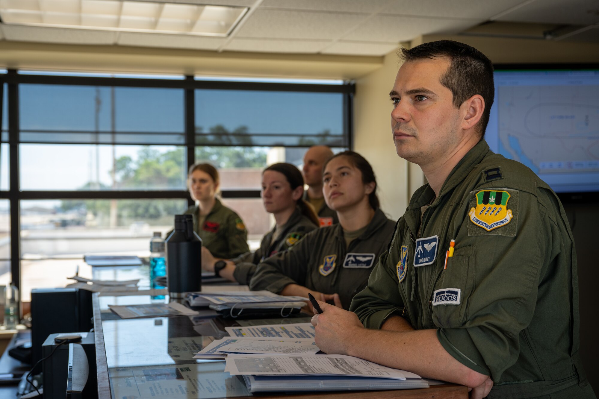 Aircrew from the 20th and 96th Bomb Squadrons listen to a pre-flight weather brief as part of exercise Bayou Warrior at Barksdale Air Force Base, La., June 12, 2024. Exercise Bayou Warrior is a conventional readiness exercise that evaluates the wing’s ability to generate and execute missions. (U.S. Air Force Photo by Senior Airman Seth Watson)