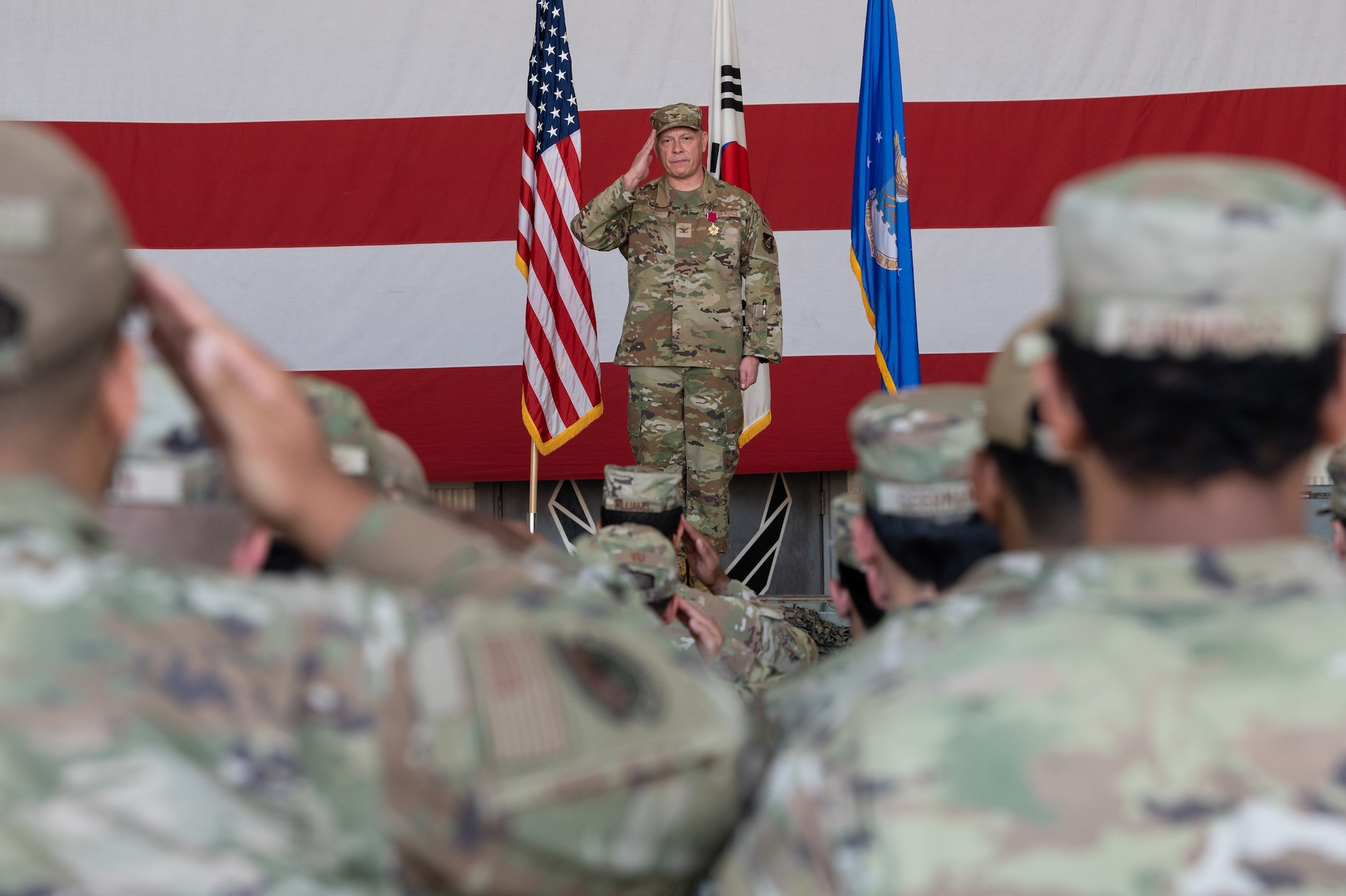 U.S. Air Force Col. Christopher Lacek, 8th Mission Support Group outgoing commander, renders his final salute as commander during the 8th MSG change of command ceremony at Kunsan Air Base, Republic of Korea.