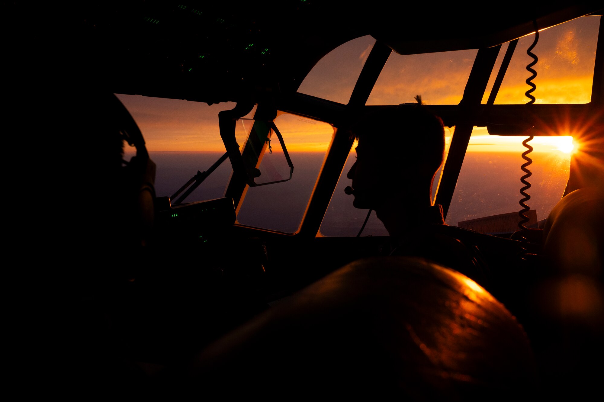 An airman pilots a C-130J Super Hercules.
