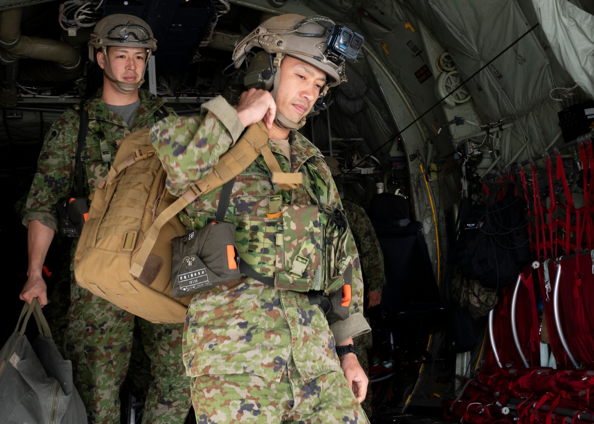 Japan Ground Self-Defense Force paratroopers assigned to the 1st Airborne Brigade depart a U.S. Air Force C-130J Super Hercules assigned to the 36th Airlift Squadron.