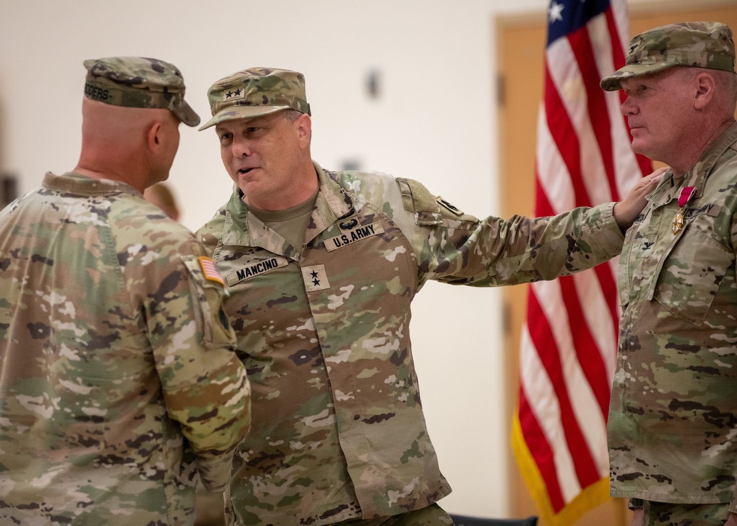 Maj. Gen. Thomas H. Mancino, adjutant general for Oklahoma, talks to Lt. Col. William Kale Rogers, incoming commander of the 45th Field Artillery Brigade, Oklahoma Army National Guard and Col. Johnnie Dale Moss, outgoing commander of the 45th FAB. The changing of command signifies the transfer of responsibility from outgoing to incoming commander.  (Oklahoma National Guard photo by Pfc. Brooklyn Clark)