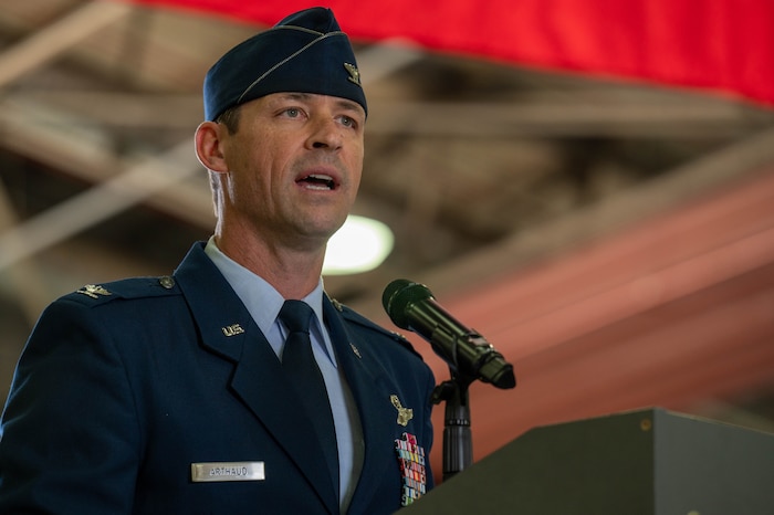 man speaking at ceremony