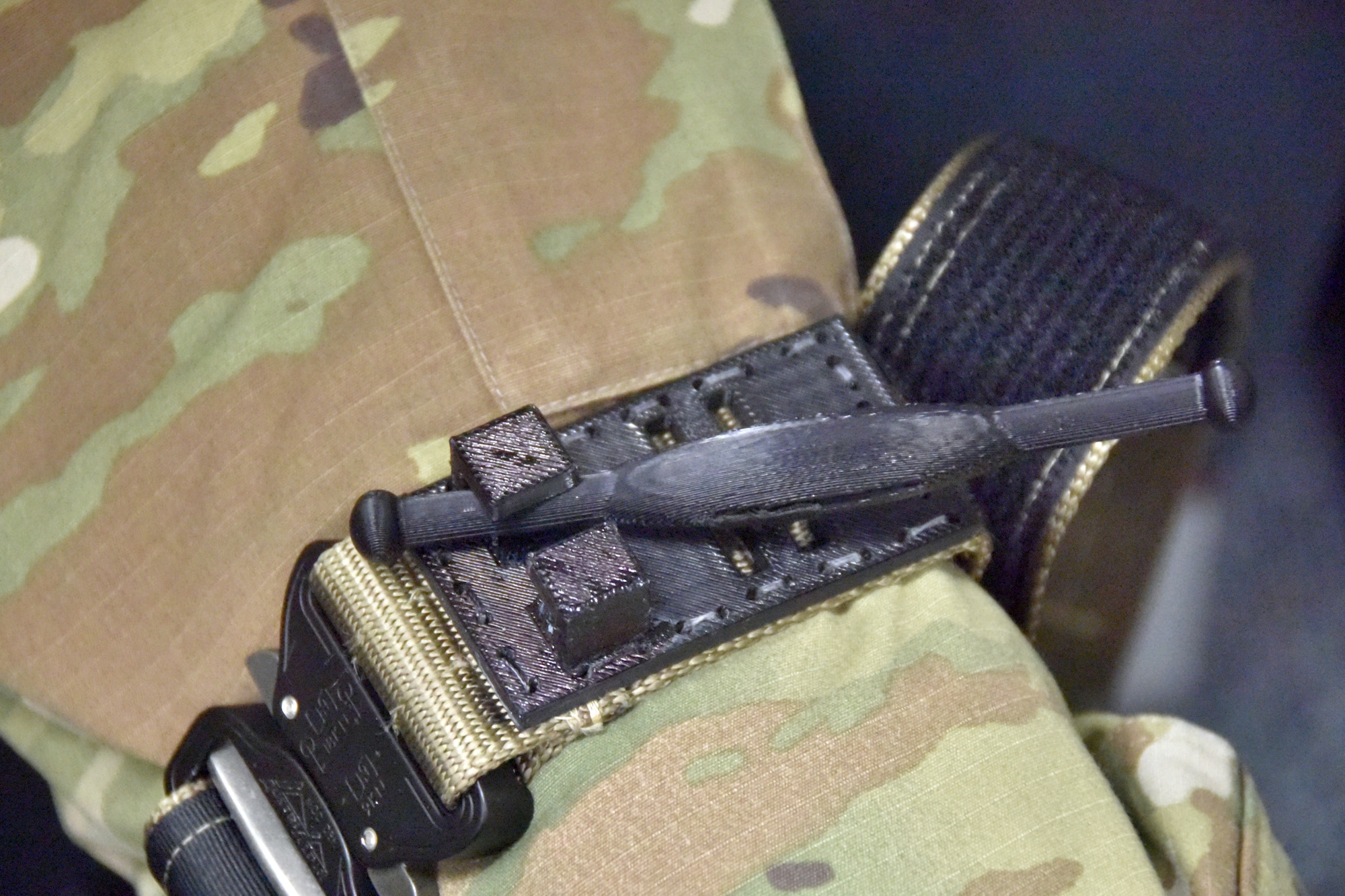 A close-up of a tourniquet on a leg.