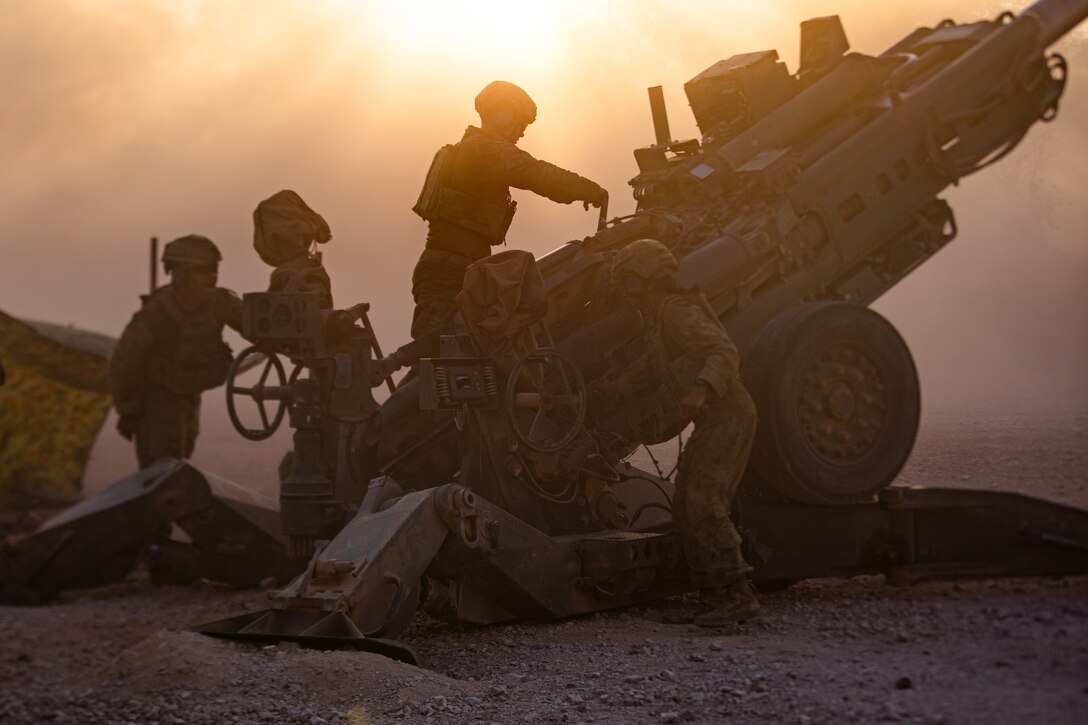 U.S. Marines with India Battery, 2nd Battalion, 5th Marine Regiment (Reinforced), Marine Rotational Force – Darwin 24.3, and Australian Army Soldiers with 102 Battery, 8th/12th Regiment, Royal Australian Artillery, prepare to fire an M777A2 medium towed 155 mm howitzer during Exercise Thunder Walk 24 at Mount Bundey Training Area, NT, Australia, June 5, 2024. U.S. Marines and their Australian Allies rehearsed delivering precision artillery fire, integrating the fire direction center, and enhancing the joint combat space. (U.S. Marine Corps photo by Cpl. Migel A. Reynosa)