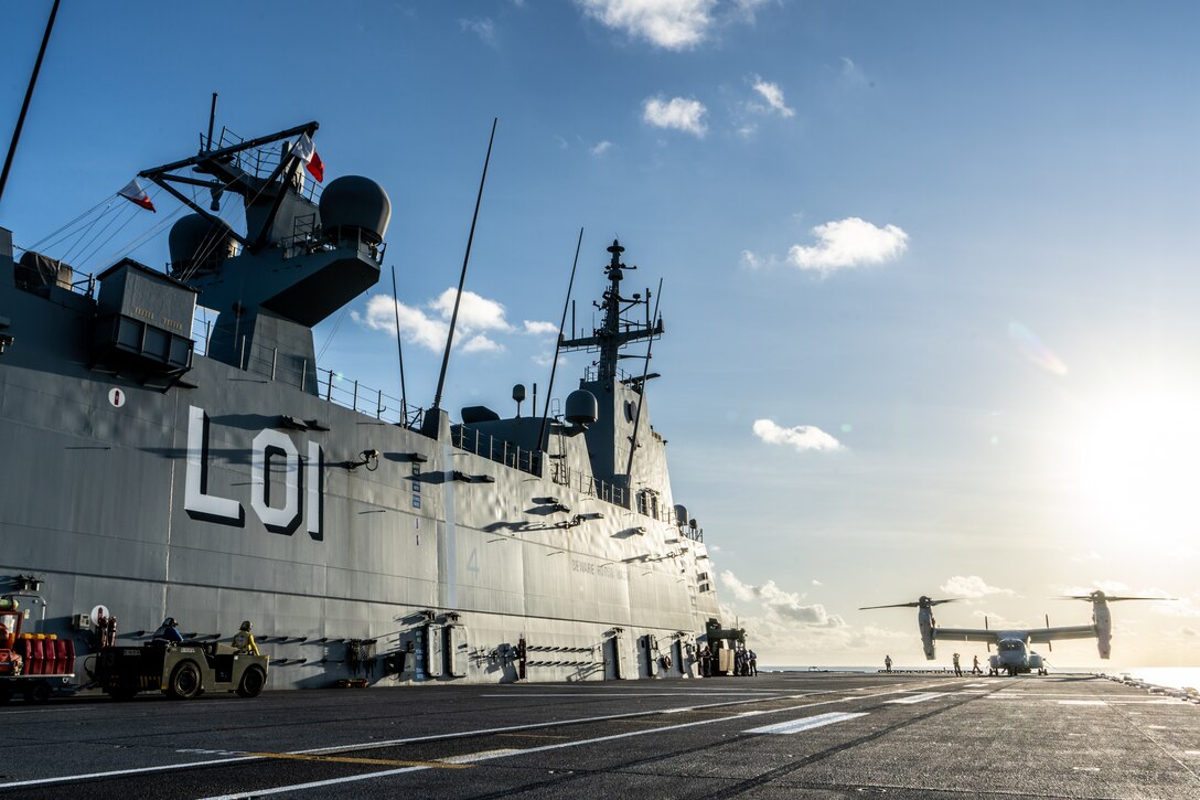 U.S. Marines with Marine Medium Tiltrotor Squadron 268 (Reinforced), Marine Rotational Force – Darwin 24.3, land an MV-22B Osprey on the flight deck of HMAS Adelaide (LO1), as part of deck landing qualifications during a Wet and Dry Exercise Rehearsal, in the Arafura Sea, June 4, 2024. Marines and Sailors embarked on HMAS Adelaide (L01) alongside their Australian Allies to participate in WADER, transiting from Darwin to Townsville from June 2-20, 2024. During WADER, elements from the MRF-D Marine Air-Ground Task Force will conduct MV-22B Osprey deck landing qualifications, a live-fire deck shoot, medical subject matter expert exchanges, enhance amphibious fires, command and control, and initiate a ship-to-shore movement in order to set conditions for future operational tasking. (U.S. Marine Corps photo by Gunnery Sgt. Kassie McDole)