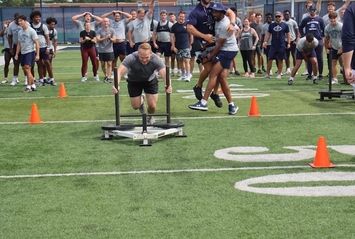 Strike Fighter Squadron (VFA) 106 Rhino Demonstration team members visited Old Dominion University (ODU) campus, June 20, to get a glimpse into the day and life of their football coaches, players and staff. The opportunity provided the demonstration team to experience the teamwork and accountability to prepare players on and off season. (U.S. Navy photo by Jennifer Cragg/Released)