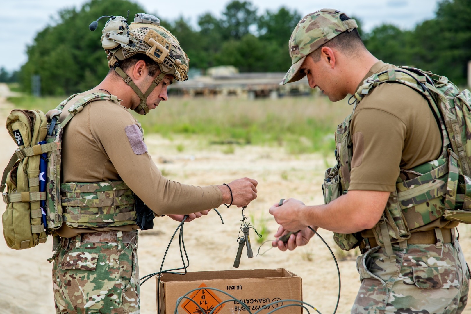 First Sgt. Akakios Pelekanos, right, and 1st Lt. Andreas Pavlou, explosive ordnance disposal team technicians with the 70th Combat Engineer Battalion of the National Guard of the Republic of Cyprus, prepare small explosive charges for detonation June 11, 2024, at the Warren Grove Gunnery Range, Warren Grove, New Jersey. The Cypriot guardsmen and the 177th Civil Engineers Squadron EOD team detonated the explosives during a training event that simulated clearing a runway of explosives dropped by enemy forces.