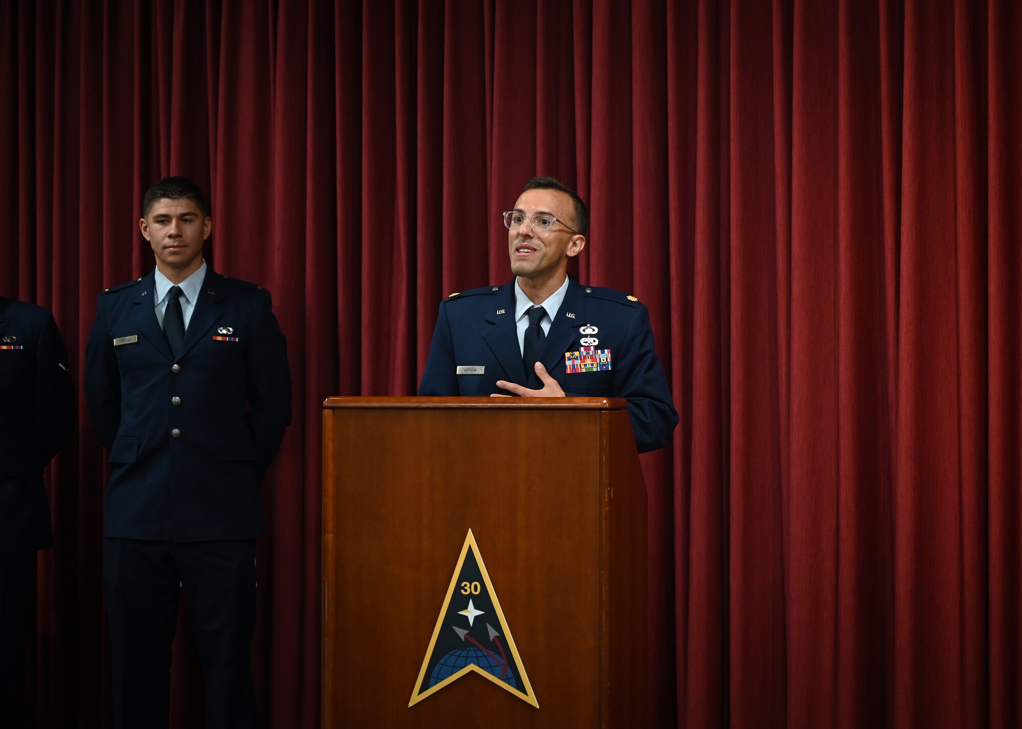 Man gives a speech at a podium.