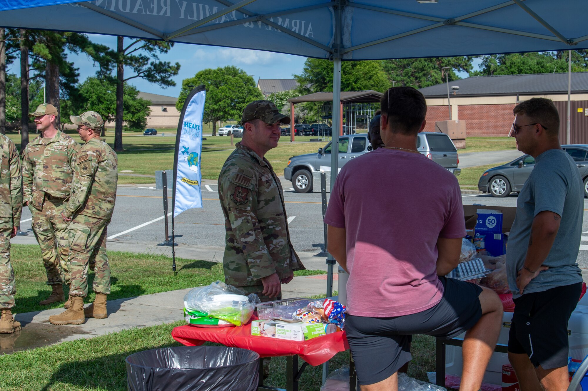 U.S. Air Force Col. Paul Sheets, 23rd Wing commander, speaks with volunteers at a Hearts Apart dinner at Moody Air Force Base, Georgia, June 20, 2024. These events allow attendees to build friendships and help ease the stress and demands on families during deployments. (U.S. Air Force photo by Airman 1st Class Iain Stanley)