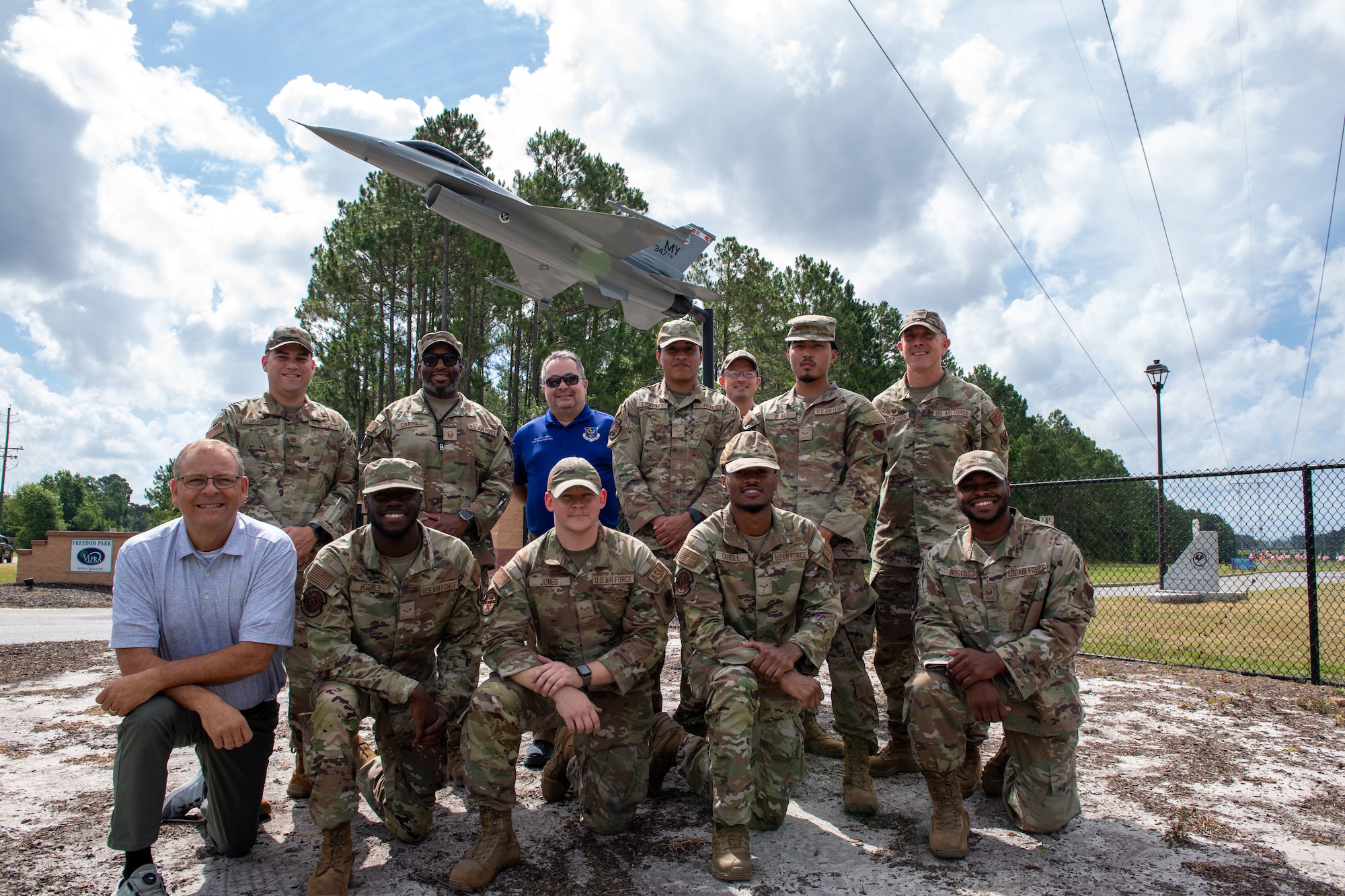 Moody Air Force Base Airmen along with leaders from the Valdosta Lowndes Parks Recreation Association (VLPRA) pose in front of a newly renovated F-16 Fighting Falcon static display at Freedom Park, Valdosta, Georgia, June 18, 2024. The renovation of the static display was a group effort between Moody AFB and leaders from the VLPRA. (U.S. Air Force photo by 2nd Lt. Benjamin Williams).