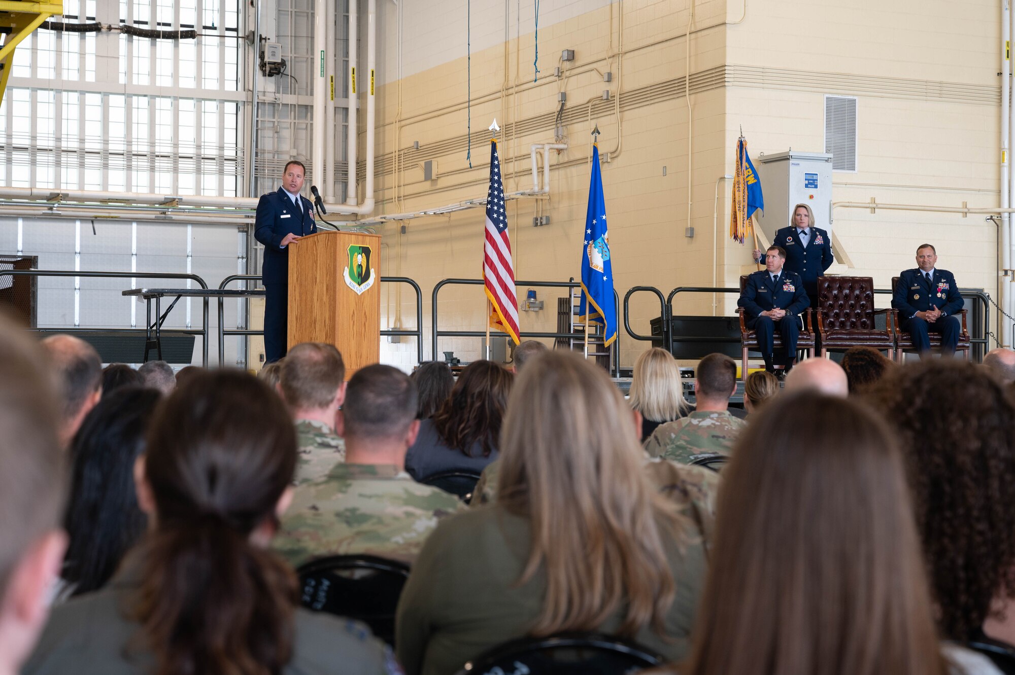 U.S. Air Force Col. John Burrell, incoming 5th Operations Group (5th OG) commander, speaks during the 5th OG Change of Command ceremony at Minot Air Force Base, North Dakota, June 21, 2024. Before taking command of the 5th OG, Burrell was the Nuclear Operations Division Chief, at the Pentagon, Arlington, Virginia. Responsible for standardizing Nuclear Command and Control operations, policy, and Nuclear Surety across the National Military Command System. (U.S. Air Force photo by Airman 1st Class Luis Gomez)