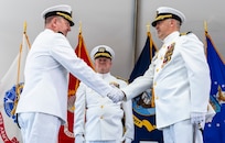 IMAGE:  Capt. Joseph Oravec (left) shakes hands with Capt. Philip Mlynarski after assuming command of Naval Surface Warfare Center Dahlgren Division during a change of command ceremony June 21. Rear Adm. Thomas Dickinson (center), commander of Naval Surface Warfare Center and Naval Undersea Warfare Center, delivered the ceremony’s opening remarks.