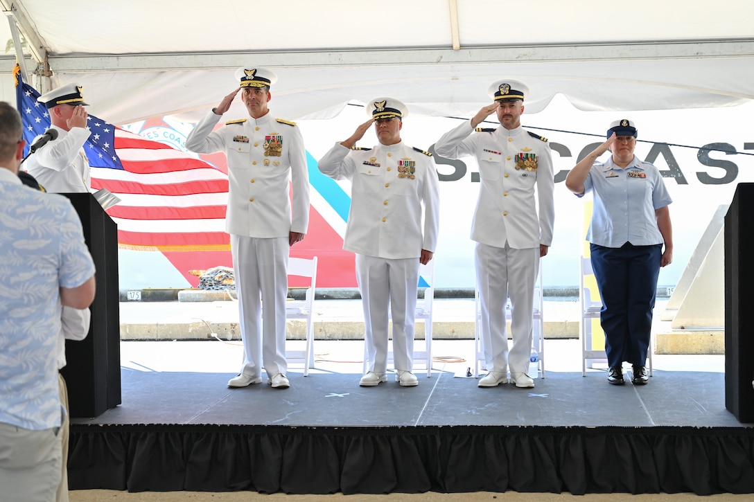 The official party salutes, June 21, 2024, during U.S. Coast Guard Cutter Dauntless' (WMEC 624) heritage recognition ceremony in Pensacola, Florida. Dauntless was recognized for 56 years of service to the nation in the presence of current and former crew members, family, and friends before it was placed in commission, special status. (U.S. Coast Guard photo by Petty Officer 2nd Class Brandon Hillard)