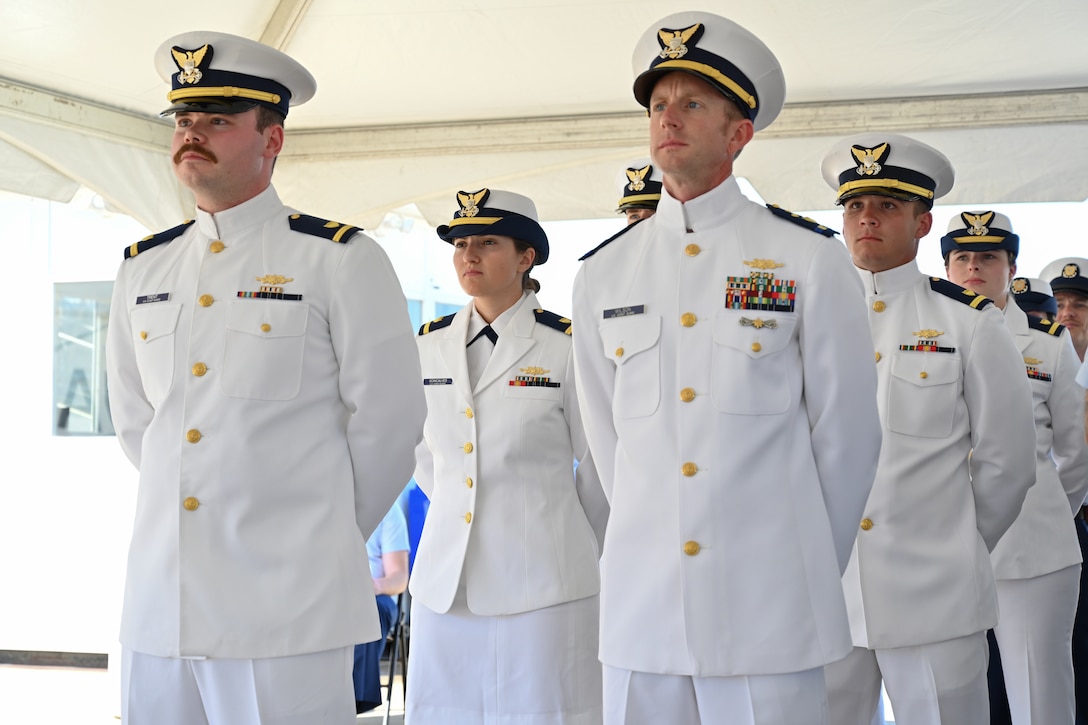 Crew members assigned to U.S. Coast Guard Cutter Dauntless (WMEC 624) stand in formation, June 21, 2024, during the cutter's heritage recognition ceremony. Dauntless was recognized for 56 years of service to the nation in the presence of current and former crew members, family and friends before it was placed in commission, special status. (U.S. Coast Guard photo by Petty Officer 2nd Class Brandon Hillard)