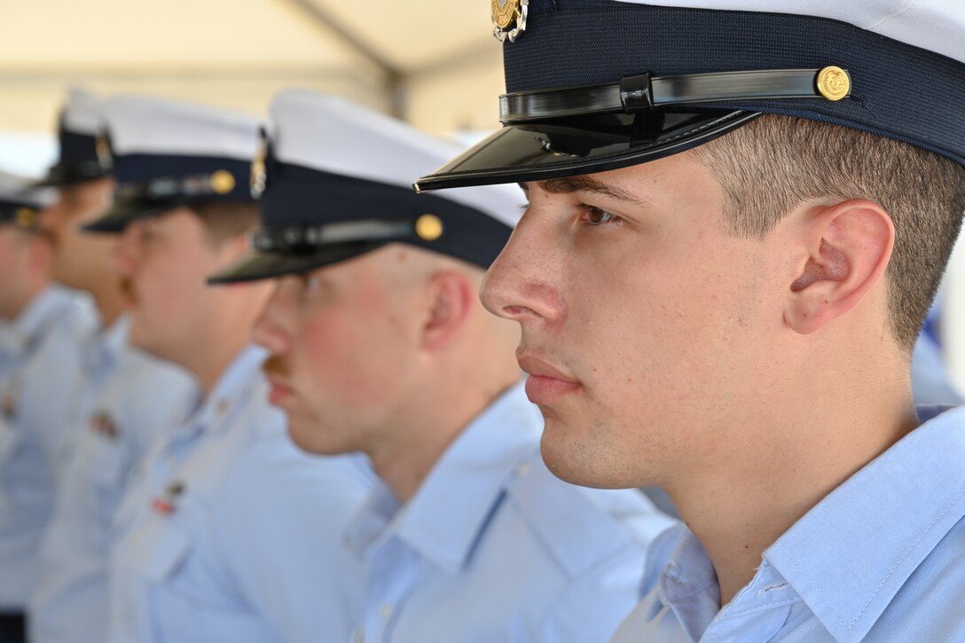 Crew members assigned to U.S. Coast Guard Cutter Dauntless (WMEC 624) stand in formation, June 21, 2024, during the cutter's heritage recognition ceremony. Dauntless was recognized for 56 years of service to the nation in the presence of current and former crew members, family, and friends before it was placed in commission, special status. (U.S. Coast Guard photo by Petty Officer 2nd Class Brandon Hillard)