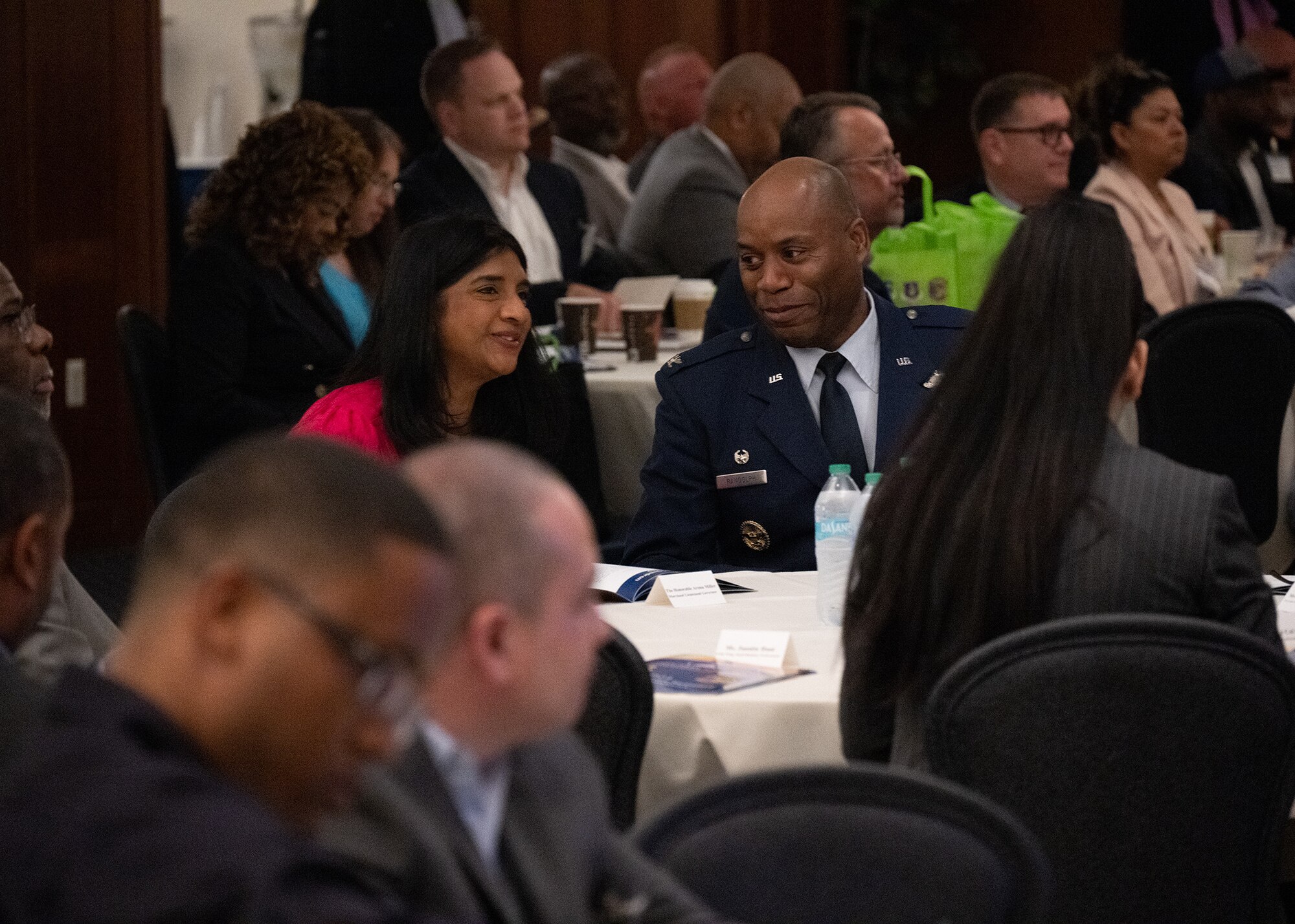 Maryland Lt. Gov. Aruna Miller, left, speaks with U.S. Air Force Col. Todd E. Randolph, 316th Wing and installation commander, during the Small Business Summit at Joint Base Andrews, Maryland, June 13, 2024.