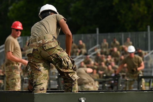 U.S. Air Force Airmen from the 1st Munitions Squadron, complete the first of four events in preparation for the Air Force Combat Operation Competition, at Joint Base Langley- Eustis, Virginia, June 3, 2024. The team tested their ability to execute the load without committing safety violations. (U.S. Air Force Photo by Airman 1st Class Gerald Ligeralde)