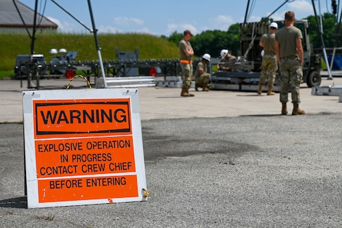 U.S. Air Force Airmen from the 1st Munitions Squadron, complete assembly on a munitions assembly conveyor in preparation for the Air Force Combat Operation Competition at Joint Base Langley- Eustis, Virginia, June 3, 2024. The MAC assembly area contains explosives and other hazardous materials and only authorized personnel may enter. (U.S. Air Force Photo by Airman 1st Class Gerald Ligeralde)