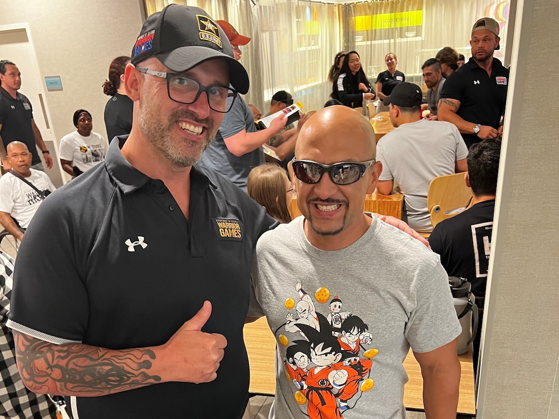 Team Army coach and mentor Greg Quarles meets Army veteran Henry Escobedo of Team Army for the first time at a team meeting before Warrior Games in Orlando Florida