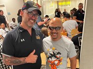 Team Army coach and mentor Greg Quarles meets Army veteran Henry Escobedo of Team Army for the first time at a team meeting before Warrior Games in Orlando Florida