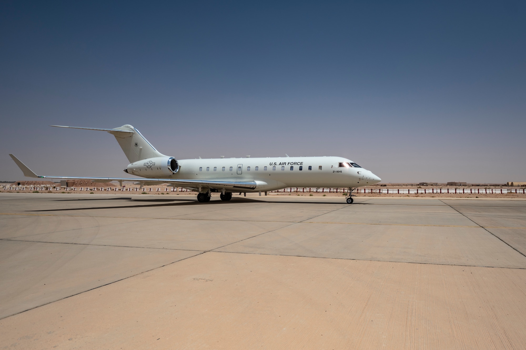 A U.S. Air Force E-11A Aircraft equipped with the Battlefield Airborne Communications Node taxis on the flightline at an undisclosed location within the U.S. Central Command area of responsibility, May 9, 2024. The E-11 enables cross-platform integration that enhances overall mission success. (U.S. Air Force photo)