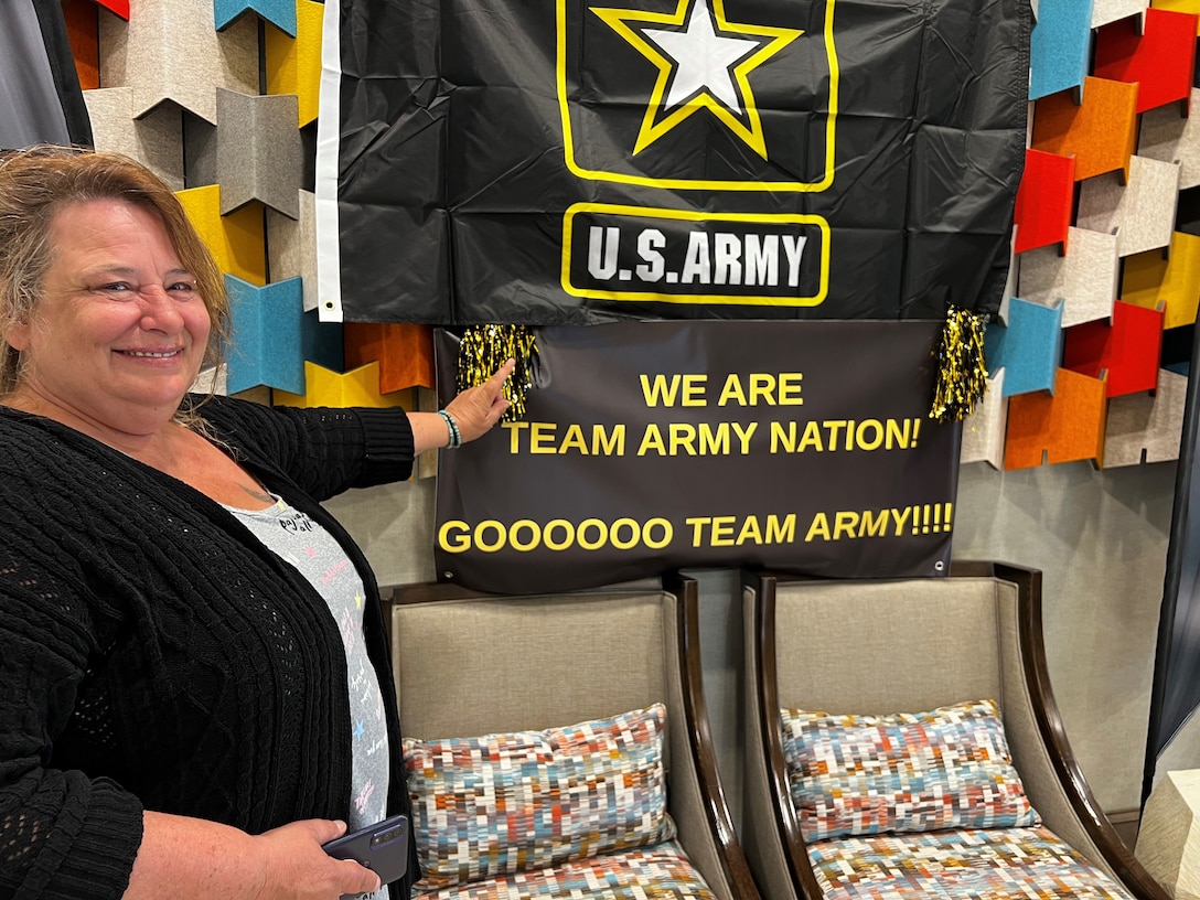 Jackie White of Syracuse, New York, stands in the lobby of her Orlando Hotel, excited about supporting Team Army at the 2024 DOD Warrior Games