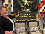 Jackie White of Syracuse, New York, stands in the lobby of her Orlando Hotel, excited about supporting Team Army at the 2024 DOD Warrior Games
