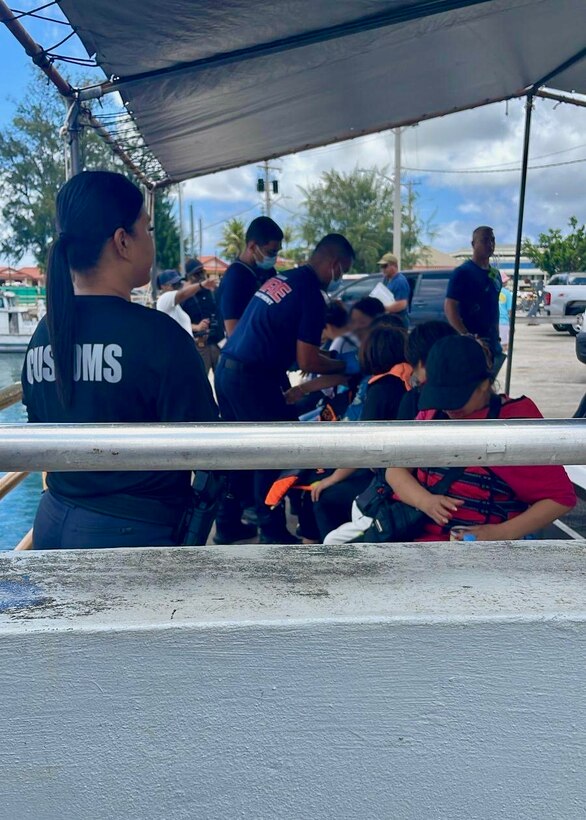 U.S. Coast Guard Forces Micronesia/Sector Guam, demonstrating preparedness and efficiency, successfully conducted a search and rescue operation for a distressed vessel 13 nautical miles north of Guam on June 23, 2024, saving 13 boaters. The Joint Rescue Sub-Center, operated by U.S. Coast Guard watchstanders in Guam, received an urgent notification from Guam Fire Rescue and 911 dispatch of a 23-foot recreational vessel, the Helen, with 13 people aboard potentially identified as nationals of the People's Republic of China, out of gas and adrift. A U.S. Coast Guard Station Apra Harbor 45-foot Response Boat-Medium crew transported the survivors to Hagåtña, where partner agency officials met them at the pier for further care and assessment. (U.S. Coast Guard photo)