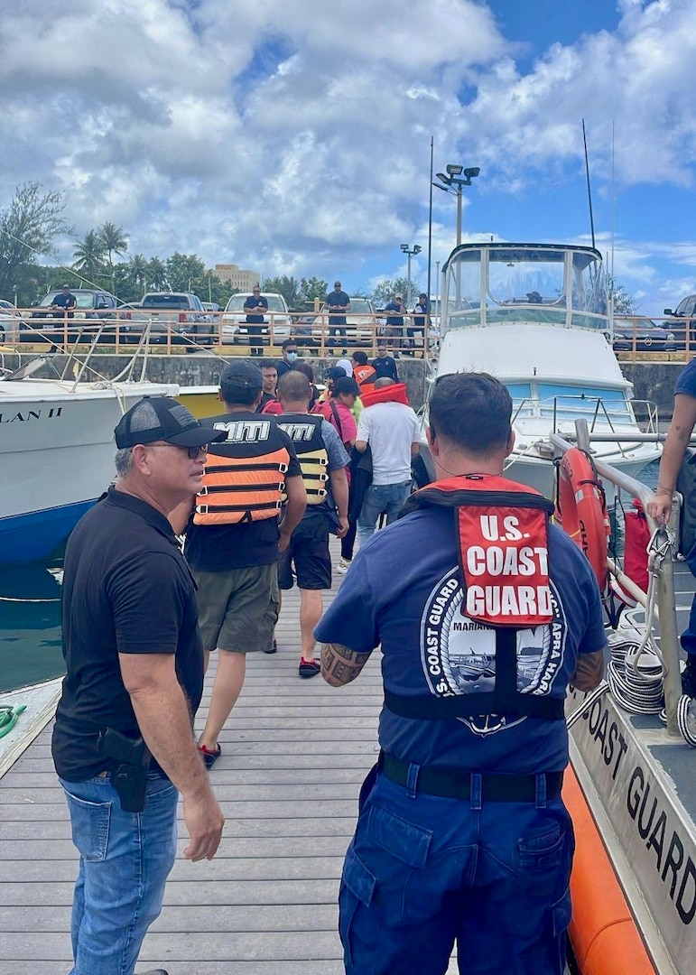 U.S. Coast Guard Forces Micronesia/Sector Guam, demonstrating preparedness and efficiency, successfully conducted a search and rescue operation for a distressed vessel 13 nautical miles north of Guam on June 23, 2024, saving 13 boaters. The Joint Rescue Sub-Center, operated by U.S. Coast Guard watchstanders in Guam, received an urgent notification from Guam Fire Rescue and 911 dispatch of a 23-foot recreational vessel, the Helen, with 13 people aboard potentially identified as nationals of the People's Republic of China, out of gas and adrift. A U.S. Coast Guard Station Apra Harbor 45-foot Response Boat-Medium crew transported the survivors to Hagåtña, where partner agency officials met them at the pier for further care and assessment. (U.S. Coast Guard photo)
