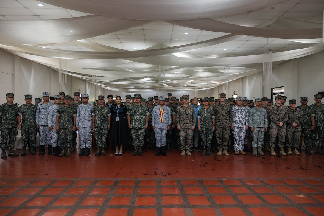 Service members with the Armed Forces of the Philippines and U.S. Marines with I Marine Expeditionary Force (Forward) pose for a photo during the Marine Aviation Support Activity 24 closing ceremony at Fort Bonifacio, Manila, Philippines, June 21, 2024. MASA is an annual Philippine-U.S. military exercise focused on mutual defense, strengthening relationships, and rehearsing emerging aviation concepts. (U.S. Marine Corps photo by Sgt. Shaina Jupiter)