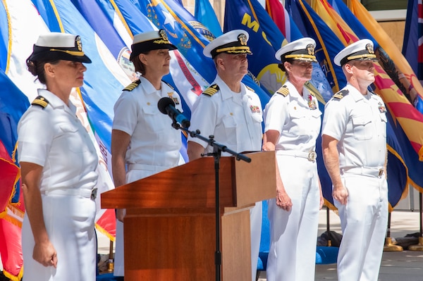 (Left to right) Lt. Cmdr. Kara Ballas, Acting Executive Officer, Expeditionary Medical Facility 150 Alpha; Navy Capt. Jenny Burkett, Commander, Navy Medicine Readiness and Training Command Camp Pendleton and Director, Naval Hospital Camp Pendleton; Capt. Kenneth Basford, incoming Commanding Officer, EMF 150 Alpha; Capt. Elizabeth Smith, outgoing Commanding Officer, EMF 150 Alpha; and Lt. James Carnes, Command Chaplain, EMF 150 Alpha; stand at attention during the playing of "Anchors Aweigh" during the EMF 150 Alpha change of command ceremony held on June 21, 2024, aboard Marine Corps Base Camp Pendleton.