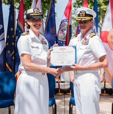 Navy Capt. Jenny Burkett (left), Commander, Navy Medicine Readiness and Training Command Camp Pendleton and Director, Naval Hospital Camp Pendleton, presents Capt. Elizabeth Smith, outgoing Commanding Officer, Expeditionary Medical Facility 150 Alpha, with the Legion of Merit medal in recognition of her exceptionally meritorious conduct in the performance of outstanding service during her nearly two years in command of EMF 150 Alpha. Smith relinquished command to Capt. Kenneth Basford during a change of command ceremony held June 21, 2024, aboard Marine Corps Base Camp Pendleton.