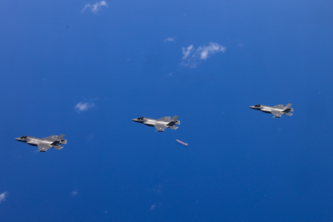 U.S. Marine Corps F-35B Lightning II aircraft with Marine Fighter Attack Squadron (VMFA) 214, Marine Aircraft Group 13, 3rd Marine Aircraft Wing, fly after receiving fuel from a  KC-130J Super Hercules with Marine Aerial Refueler Transport (VMGR) 352, MAG 11, 3rd MAW, for a littoral live-fire exercise  off the coast of Zambales, Philippines, during Marine Aviation Support Activity 24, June 15, 2024. The LLFX showcased the integrated command and control capabilities of the U.S. and Philippine armed forces in a territorial defense scenario featuring a coordinated bilateral surface and maritime strike. MASA is an annual Philippine-U.S. military exercise focused on mutual defense, strengthening relationships, and rehearsing emerging aviation concepts. (U.S. Marine Corps photo by Lance Cpl. Jennifer Sanchez)