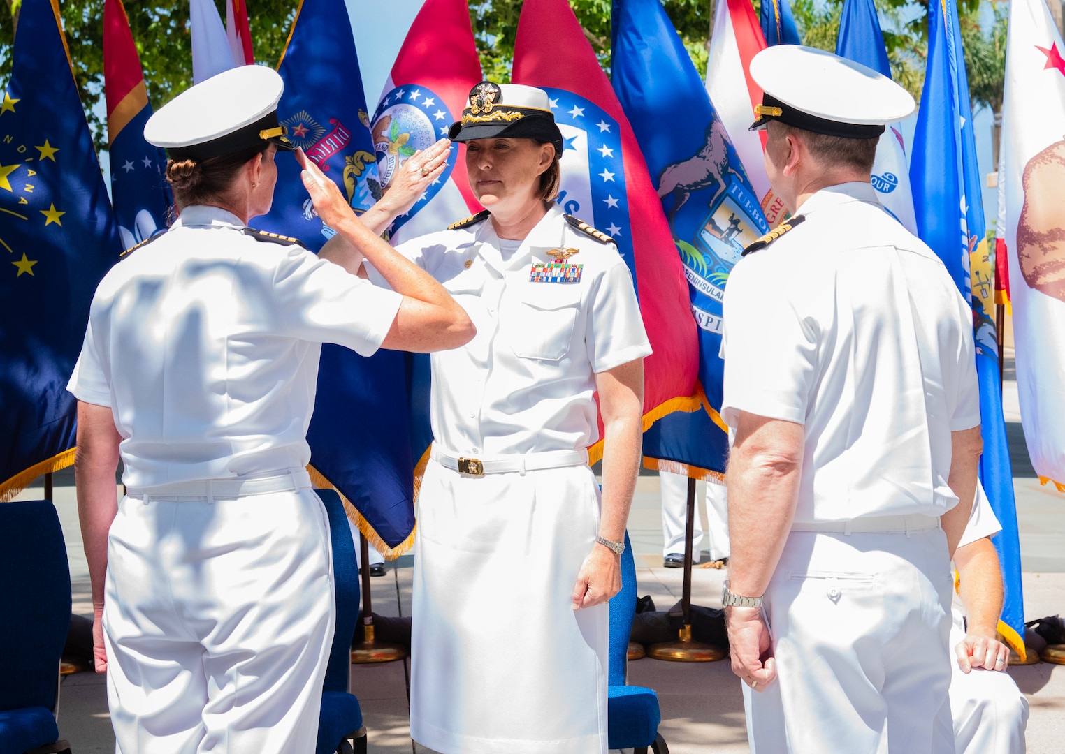 Navy Capt. Elizabeth Smith (left), outgoing Commanding Officer, Expeditionary Medical Facility 150 Alpha, salutes Capt. Jenny Burkett, Commander, Navy Medicine Readiness and Training Command Camp Pendleton and Director, Naval Hospital Camp Pendleton, during the change of command ceremony for EMF 150 Alpha held June 21, 2024, aboard Marine Corps Base Camp Pendleton. Smith relinquished command to Capt. Kenneth Basford and will transition to her new position within the 1st Marine Logistics Group.