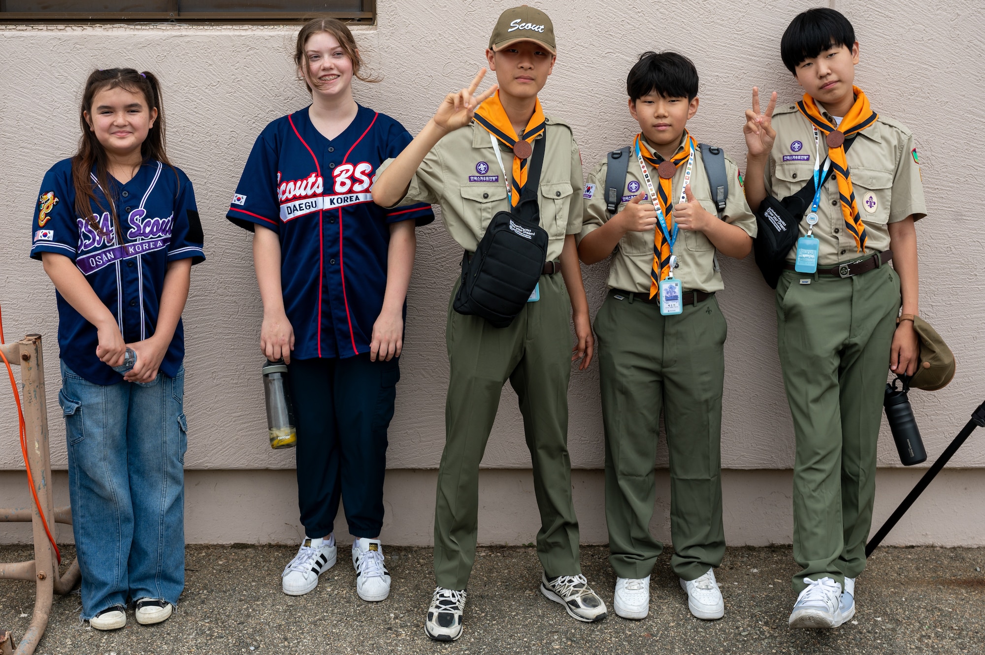 Members from Scouts BSA and the Osan City Korea Scout Association pose for a photo during a youth aviation day at Osan Air Base, Republic of Korea, June 15, 2024. Participants learned about aviation and the 51st Fighter Wing’s “Fight Tonight” mission through presentations, a hands-on-activity and a base tour. (U.S. Air Force photo by Airman 1st Class Chase Verzaal)